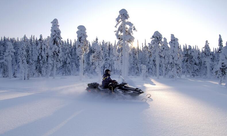 luxury snowmobile travel experience in Lapland