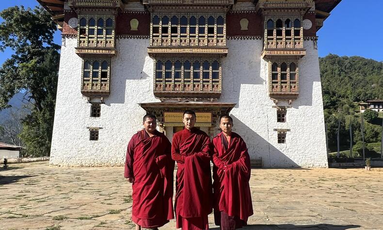 Bhutanese monks combine spiritual and academic discipline, living in austerity, studying Buddhist texts, and maintaining a deep connection with their faith.