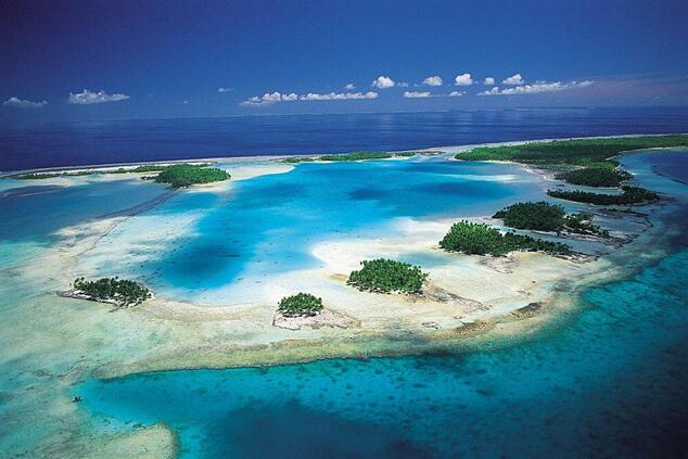 The "Blue Lagoon" is a lagoon within the lagoon surrounded by small islands full of coconut palms and with important coral reefs on its shores. romantic luxury travel remote islands polynesia blue lagoon