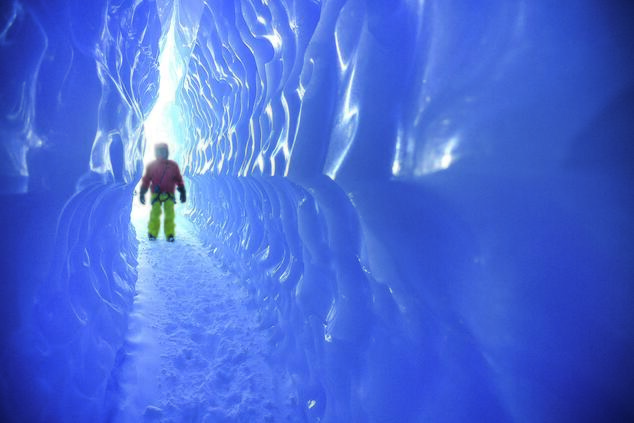 Walking inside an ice cave at the poles. remote luxury travel arctic poles arctic iceberg glacier. Blue planet travel seas