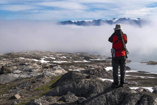 A guide, armed to protect from polar bears, near Hekla Havn.