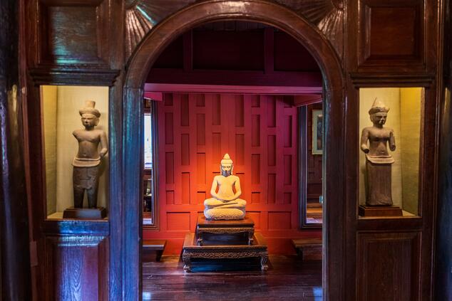 Traditional Thai artwork displayed inside the Jim Thompson House Museum.