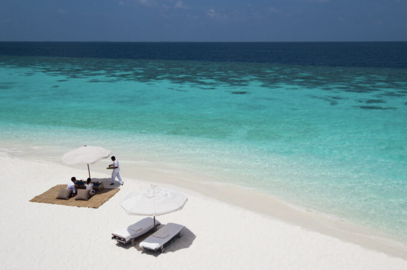 When the coral dies, it is pulverized until it forms the white sand that gives its name to the coral sand beaches. remote luxury travel maldivian islands soneva fushi beach